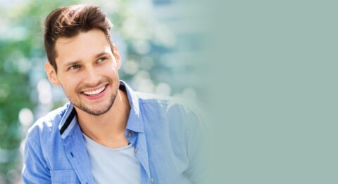 Smiling young man in blue shirt