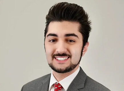 Smiling young man wearing suit and tie