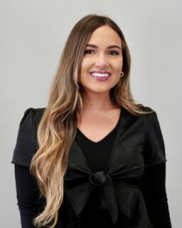 Smiling woman with long ombre hair