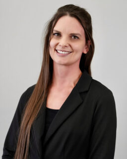 Smiling professional woman in black blazer